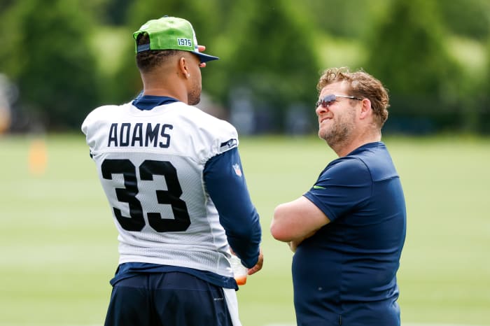 Seattle Seahawks strong safety Jamal Adams (33) talks with general manager John Schneider during minicamp practice at the Virginia Mason Athletic Center Field.
